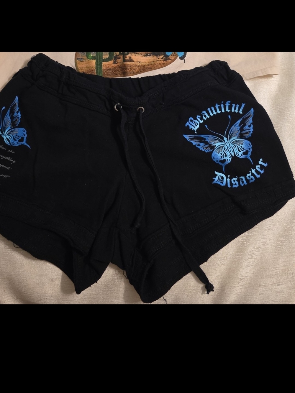 Beautiful Disaster Women's Black Shorts with Blue Butterfly Print